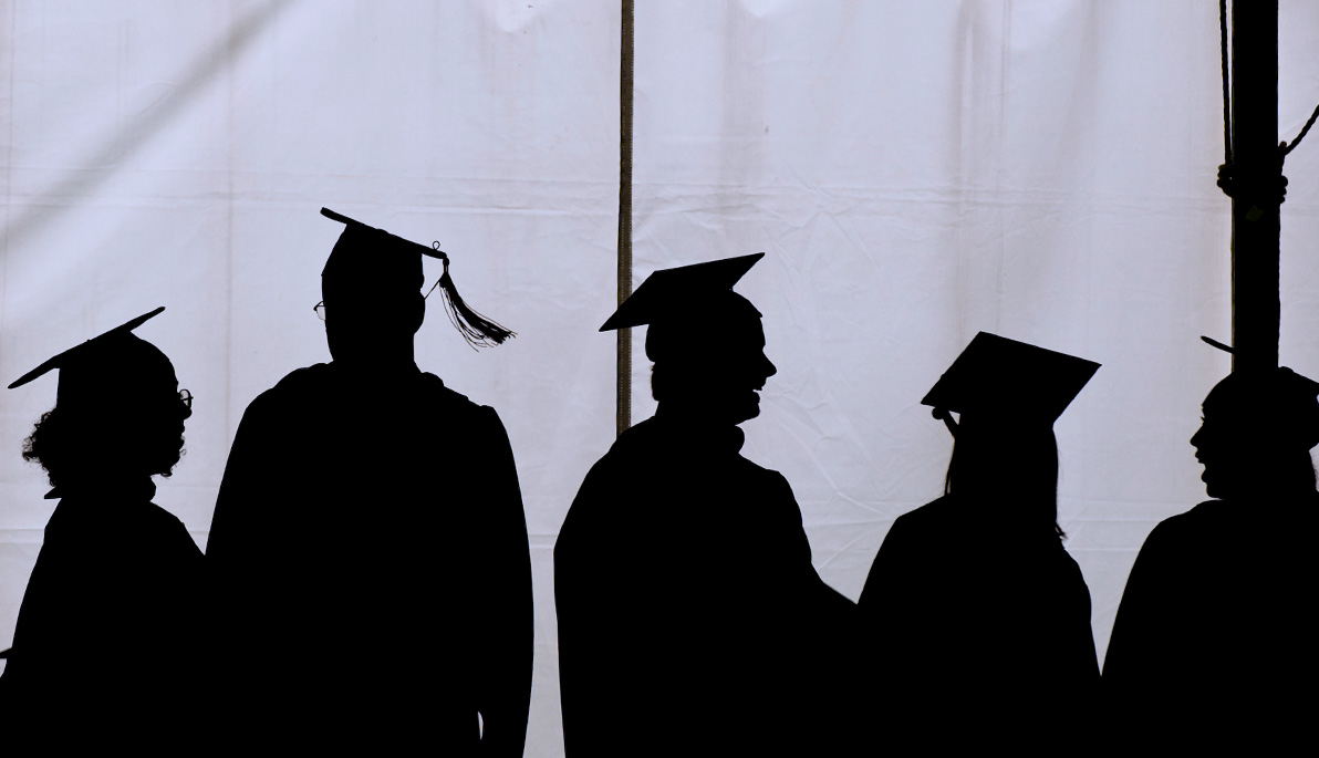 Silhouette of NYIT graduates.