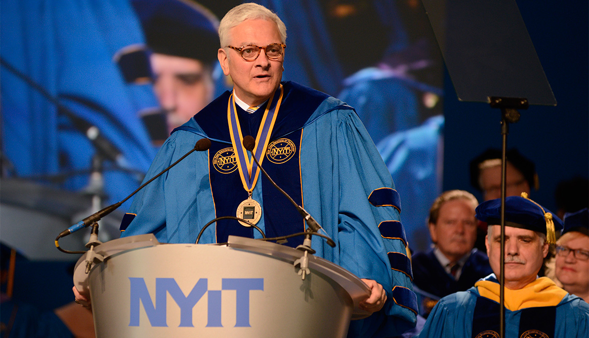 Hank Foley, NYIT’s fourth president, addressing the crowd at commencement.