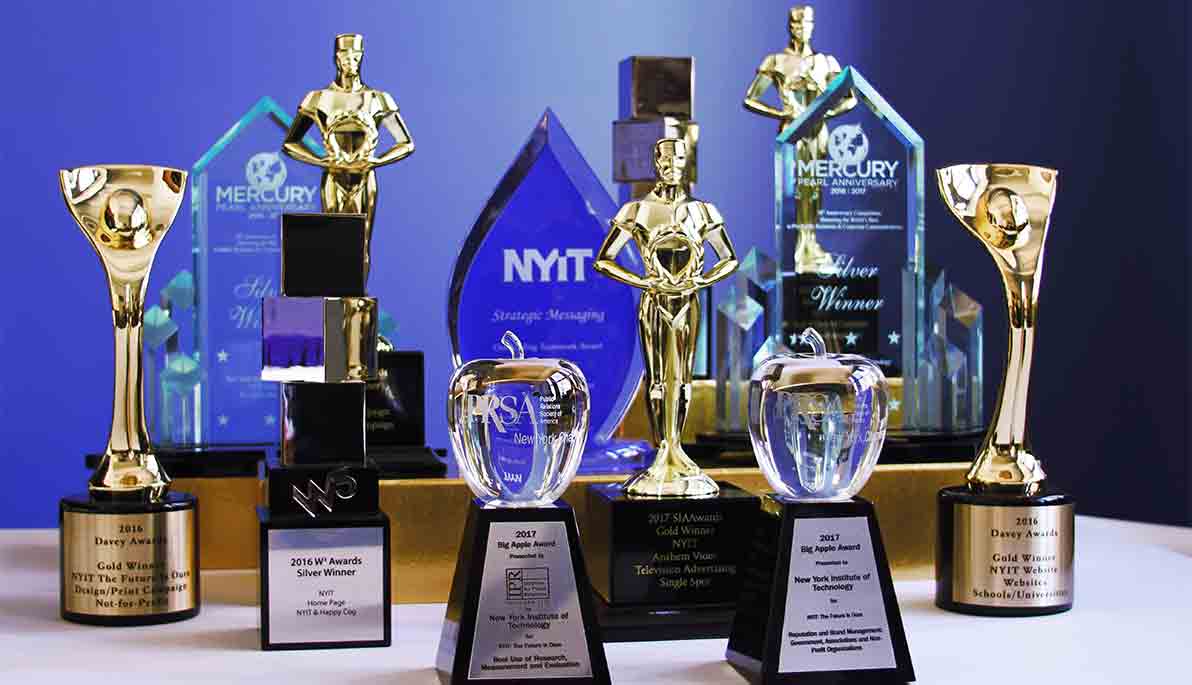 Close-up of trophies earned by NYIT in communications and marketing