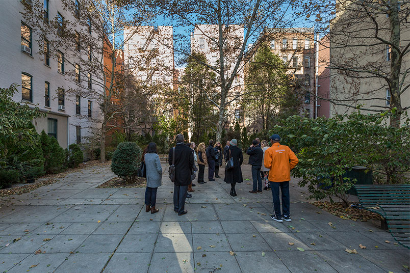 The group visits a public green space on 148th Street.