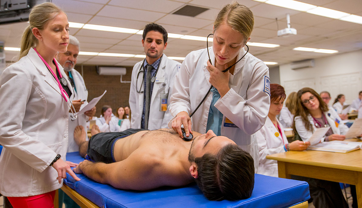 NYIT physician assistant student examining a patient.