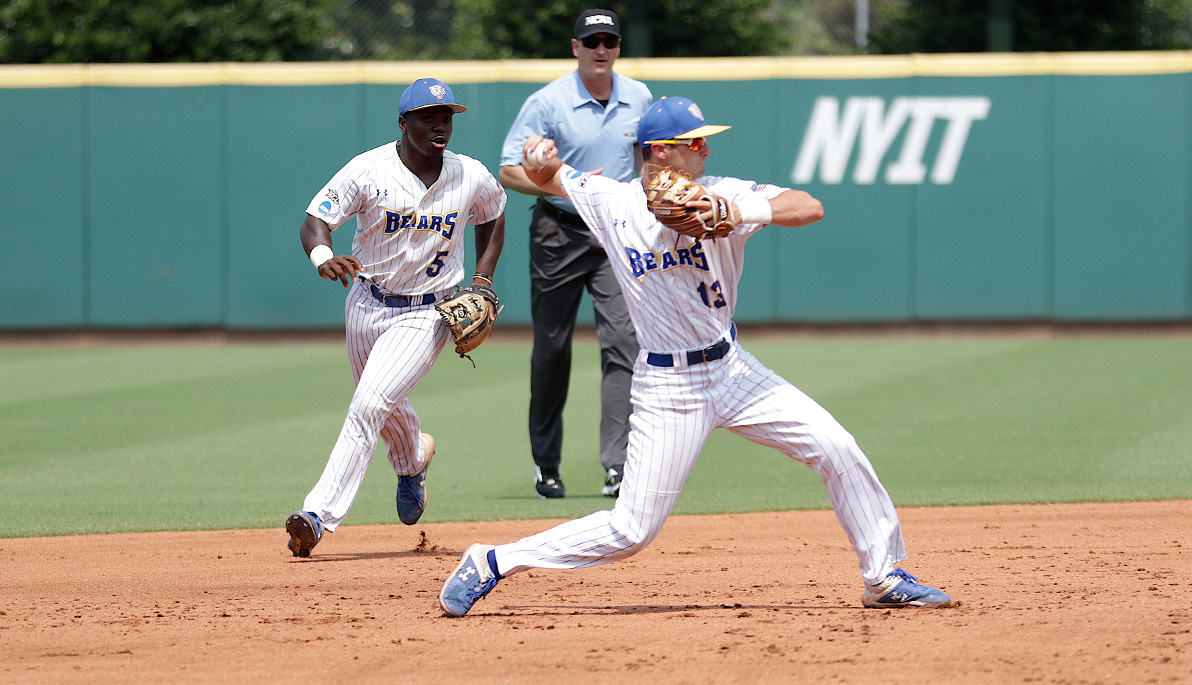 Two NYIT baseball players on the field.