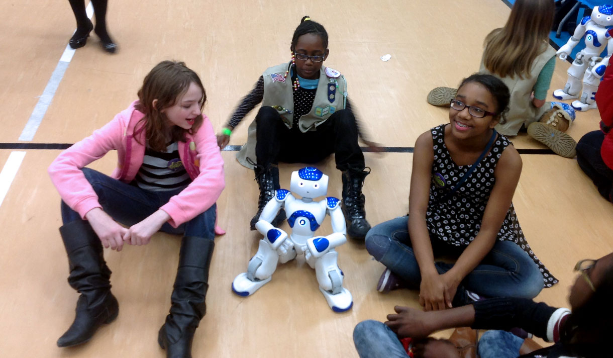 high school students with small robot