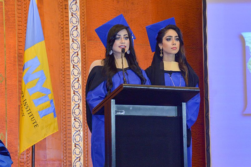 New M.B.A. graduates Nadia Abdulla Al Hammad and Rehab Abdulla address their classmates.
