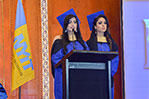 New M.B.A. graduates Nadia Abdulla Al Hammad and Rehab Abdulla address their classmates.