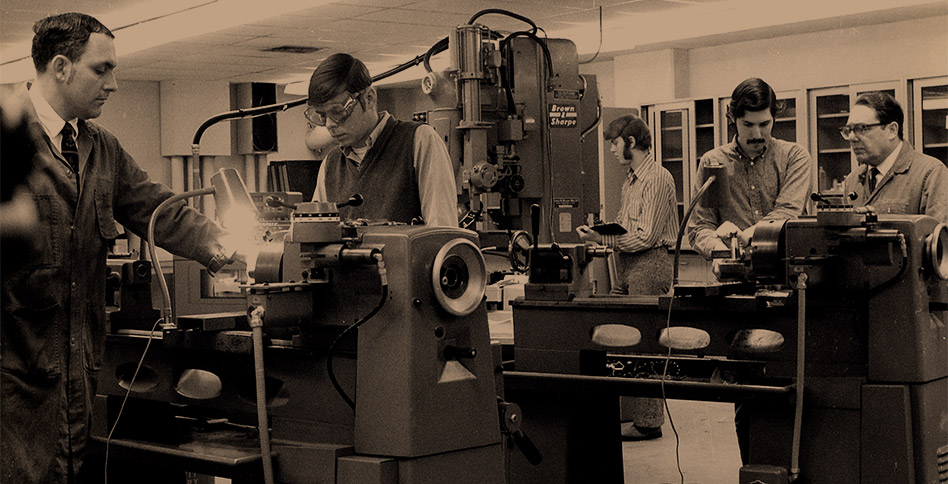 Black and white photo of students working in an old laboratory