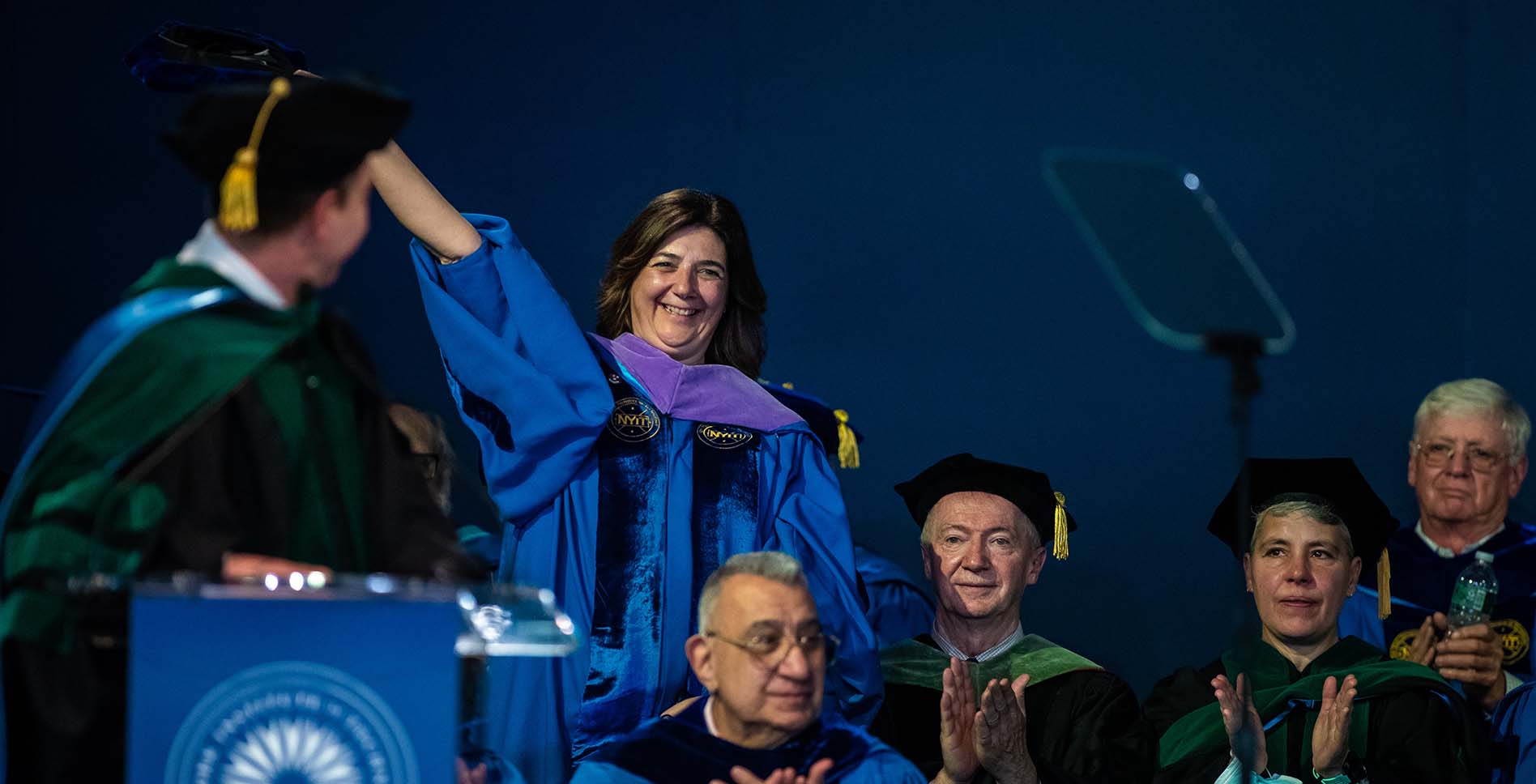 Dean Perbellini receiving applause at Commencement