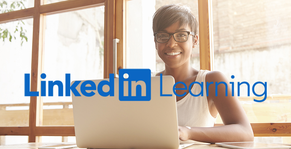 Student smiling in front of laptop, plus LinkedIn Learning logo