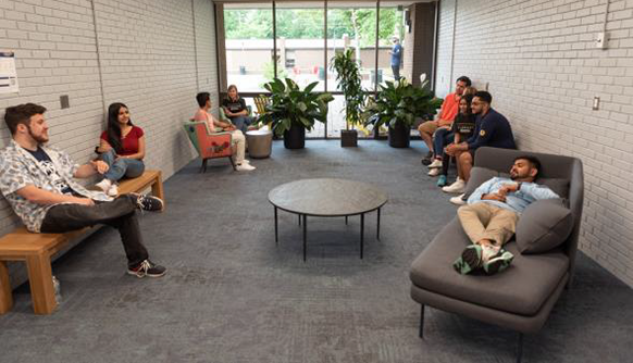 Students sitting in lounge in Anna Rubin Hall