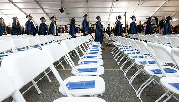 students standing in line at commencement