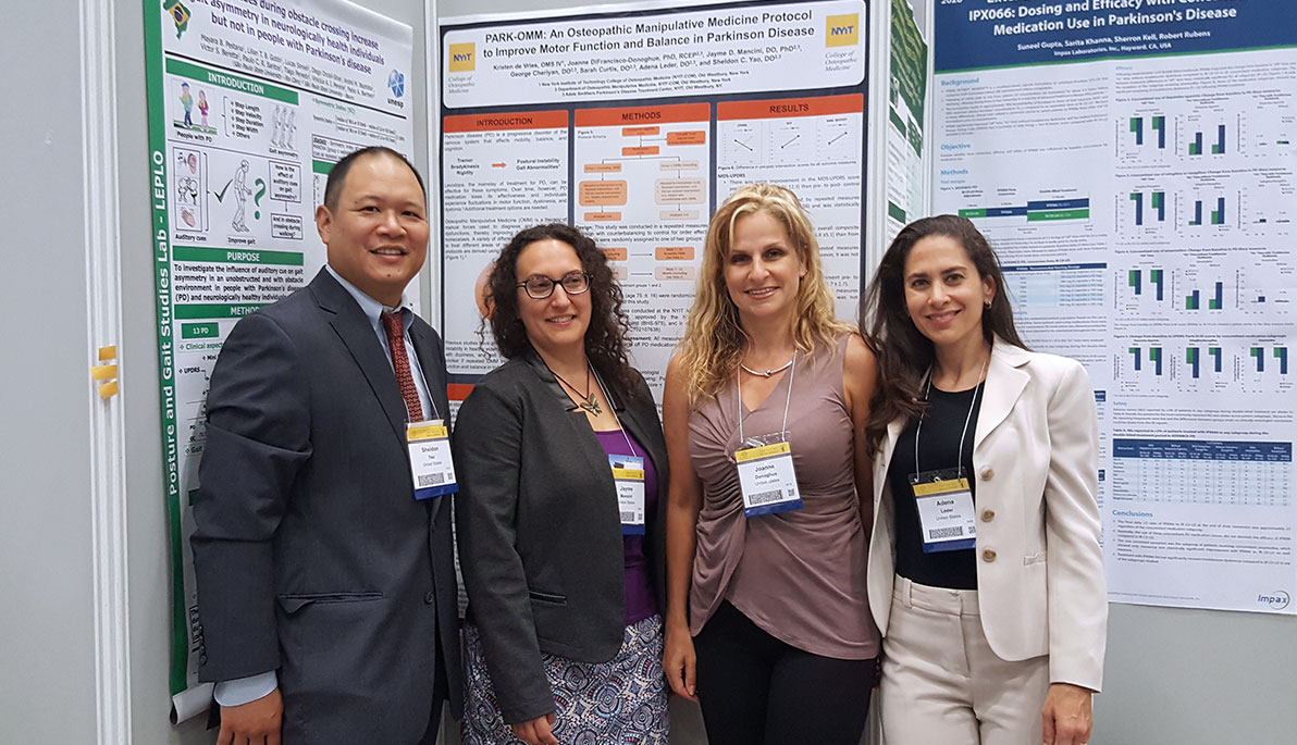 Four faculty members from NYIT College of Osteopathic Medicine at an international conference.