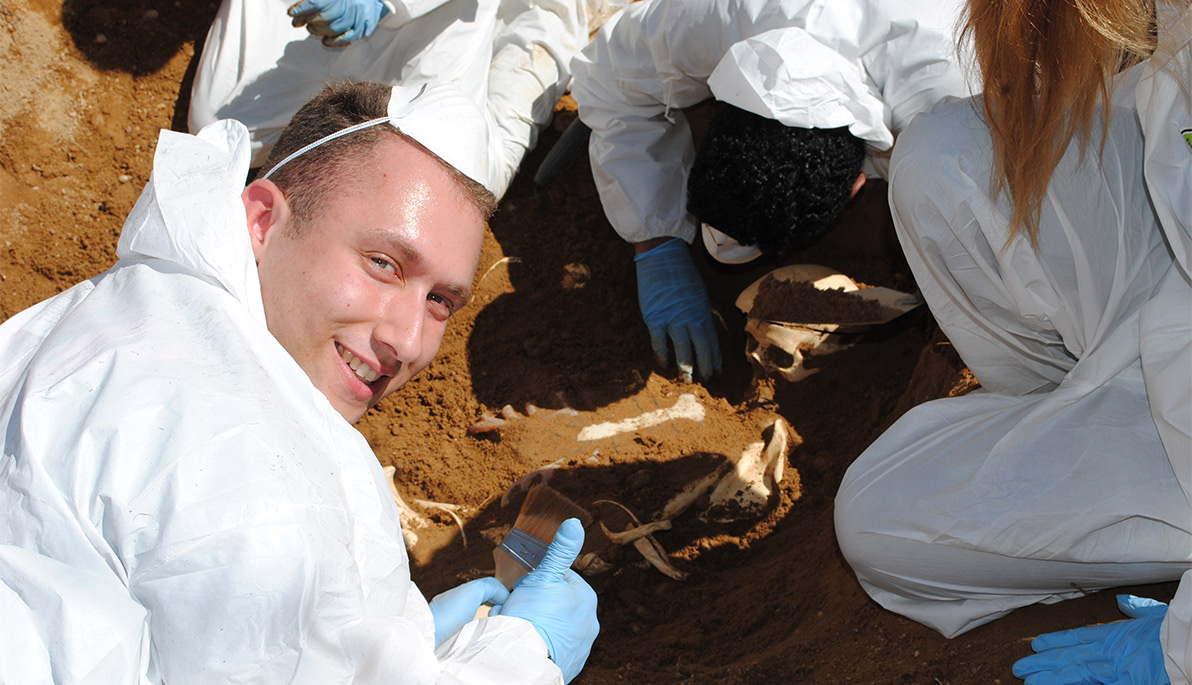 NYIT student at doing forensics at a dig site.