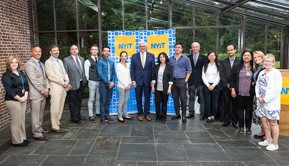 NYIT President Hank Foley with new faculty members.