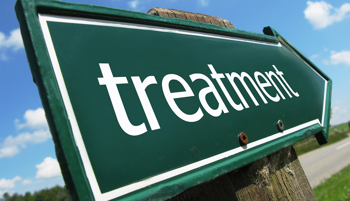 A roadside sign that says "Treatment"