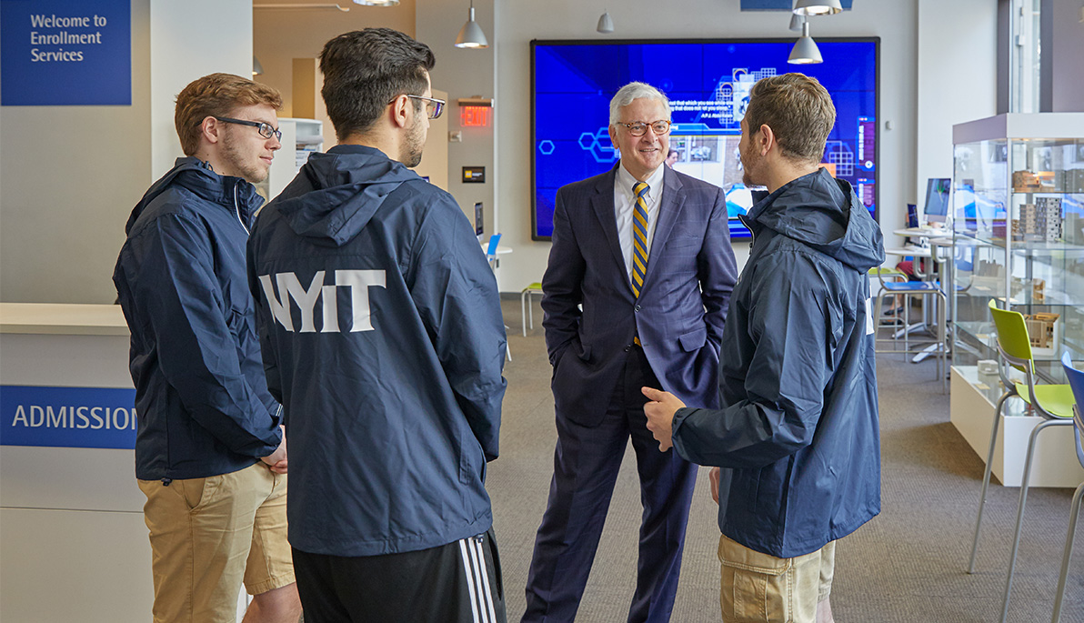 NYIT President Hank Foley with students.