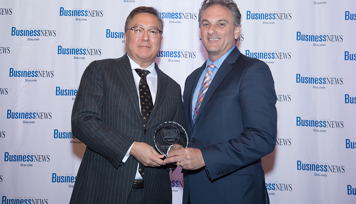 NYIT Provost Junius Gonzales receiving the Diversity in Business award