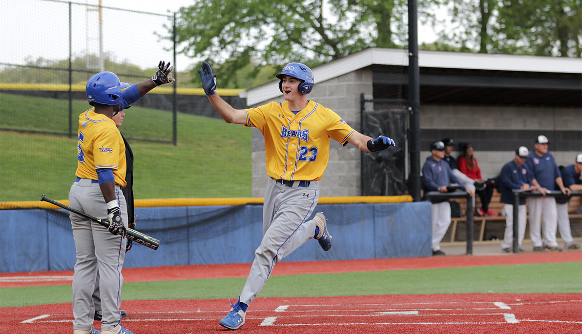 NYIT baseball player running to home plate.