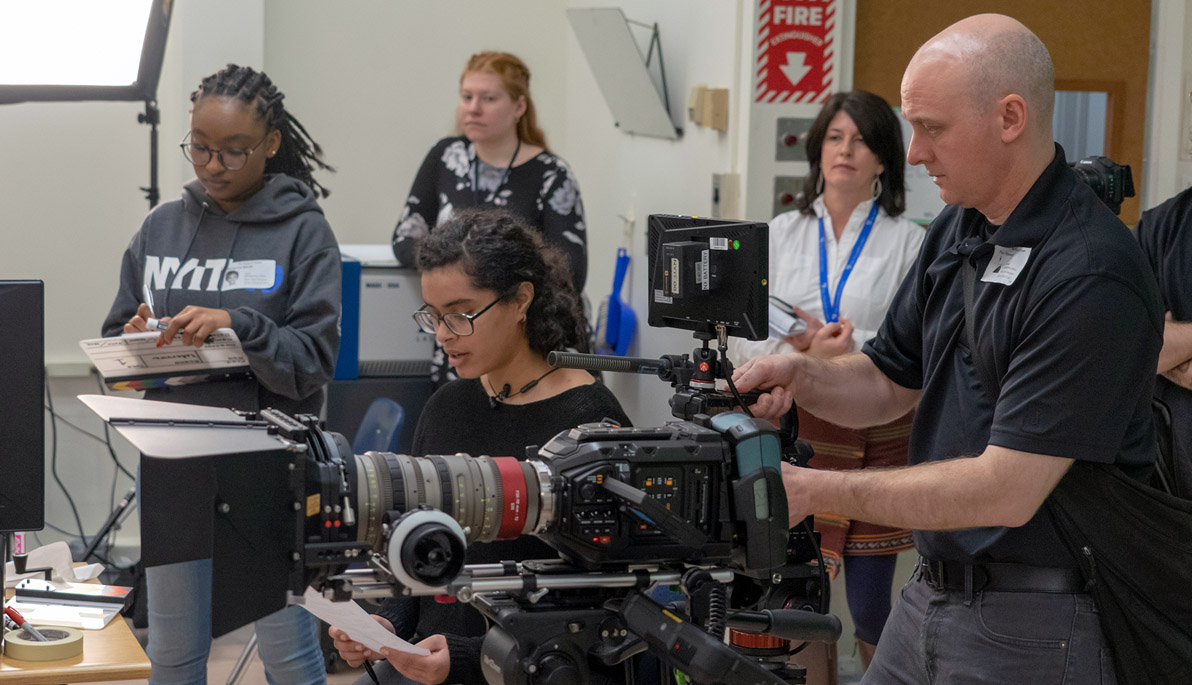 New York Tech students taking footage at Henry Viscardi School.
