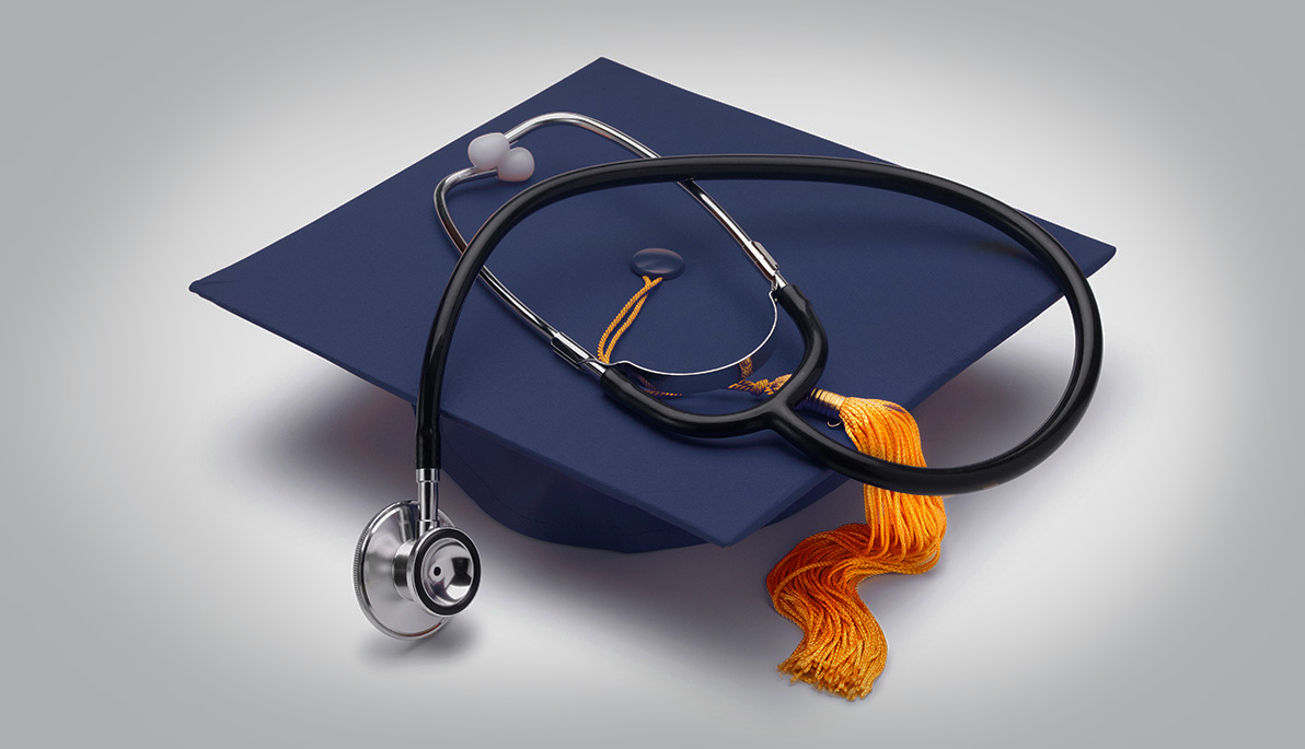 Photo of tasseled graduation mortarboard with a stethoscope on top