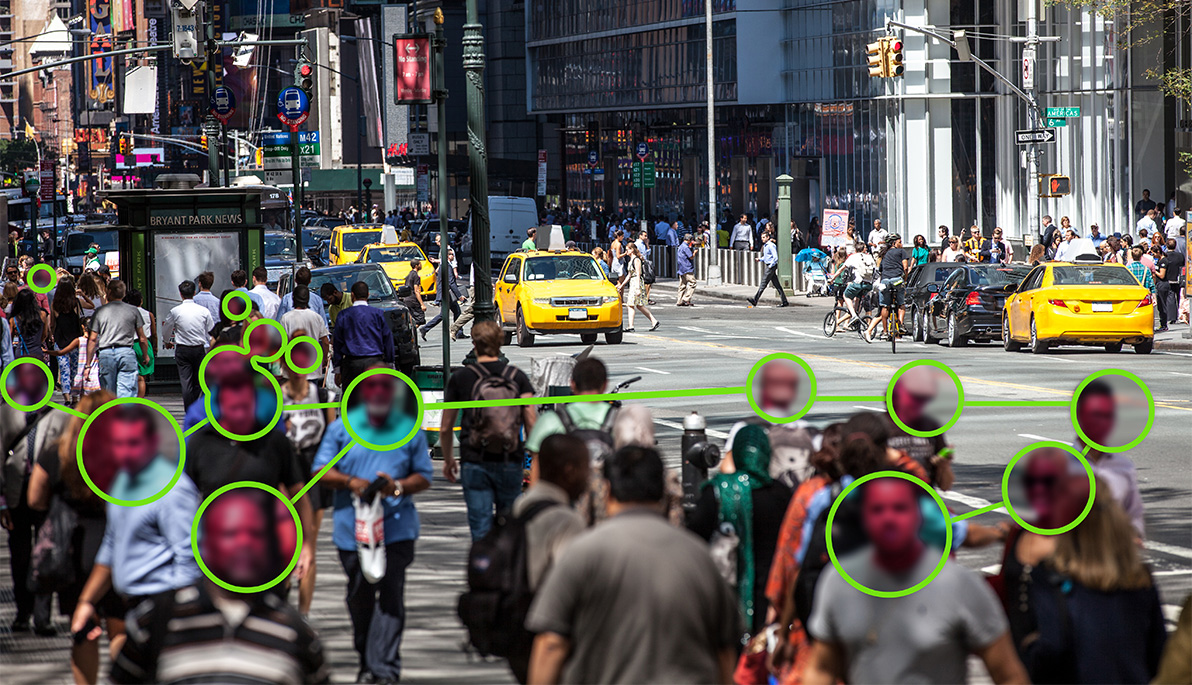 Photo of a crowded city street superimposed with connecting facial recognition circles 