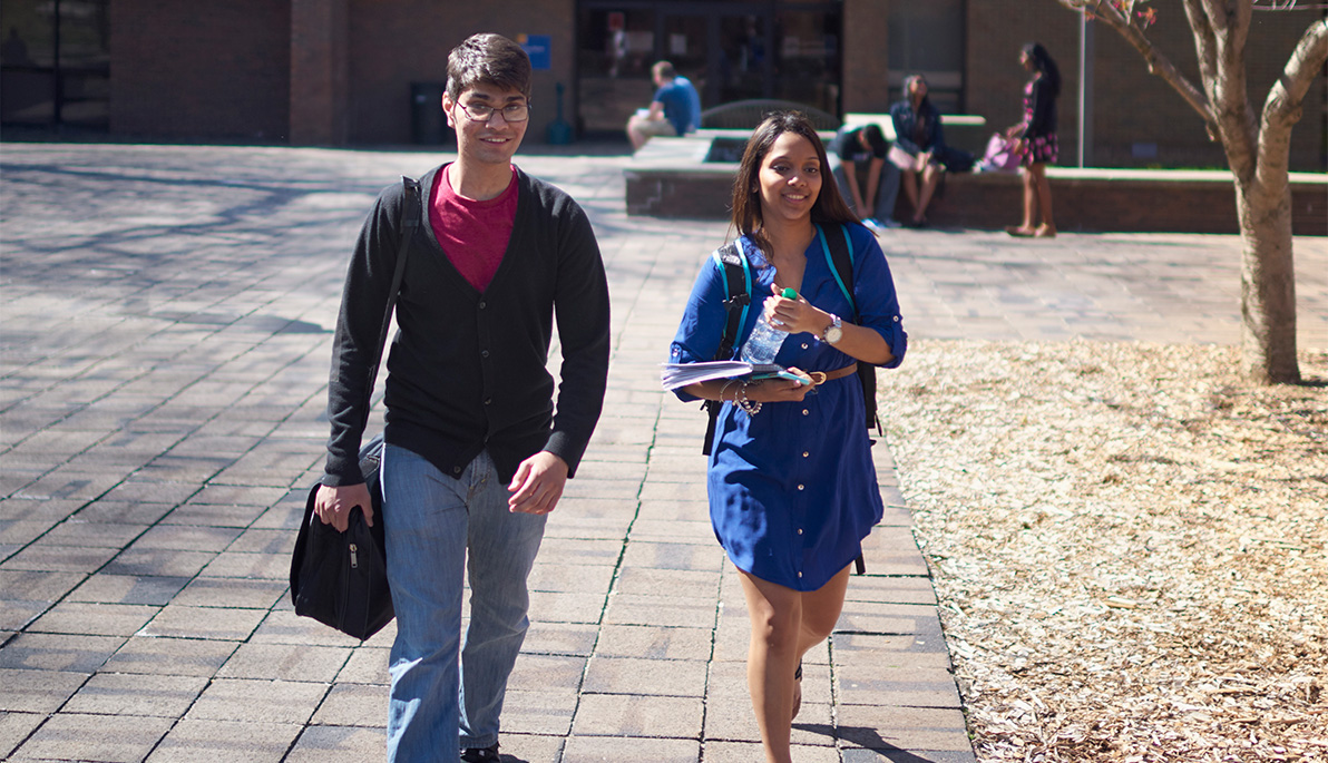 Two students walking on the Long Island campus