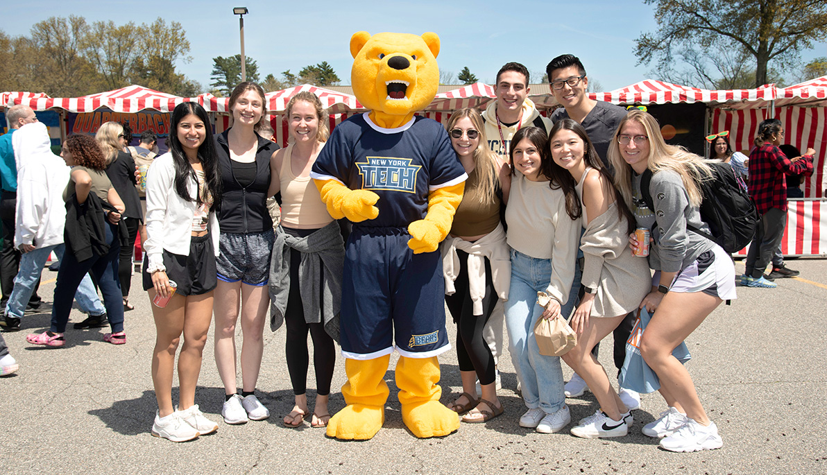Students pose with Roary at MayFest on Long Island