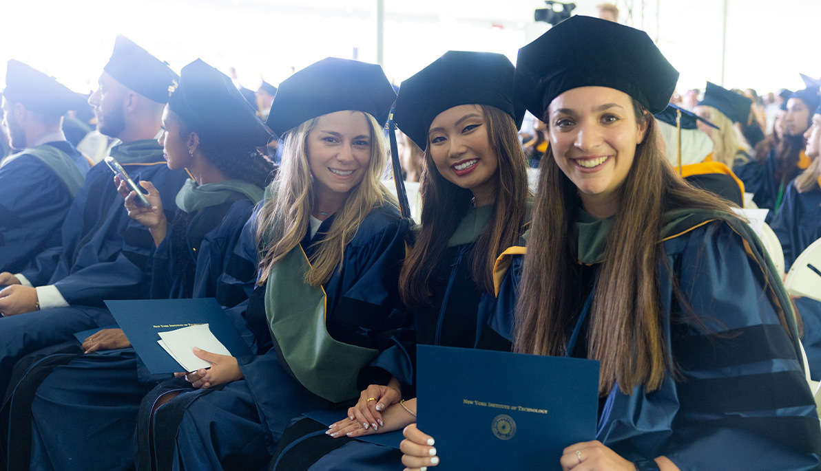 Three graduates at the 2022 graduation ceremony.
