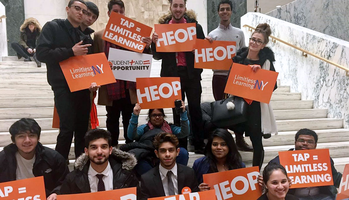 NYIT HEOP students holding HEOP signs.