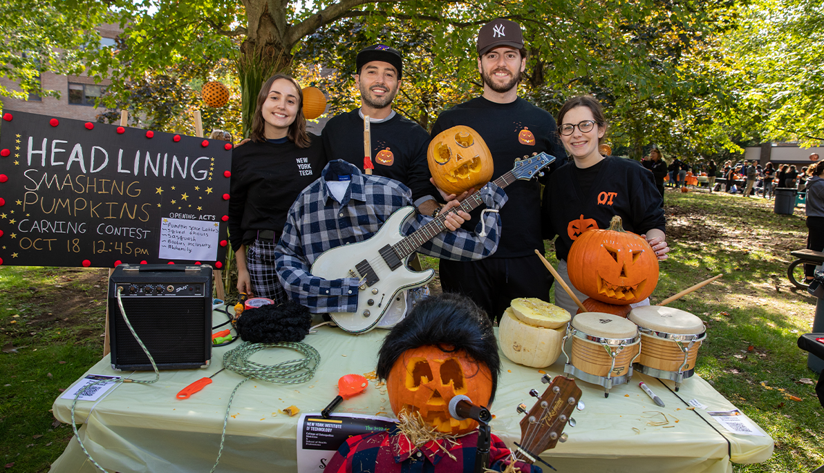 New York Tech students and their pumpkin carving creation Smashing Pumpkins on the Long Island campus.