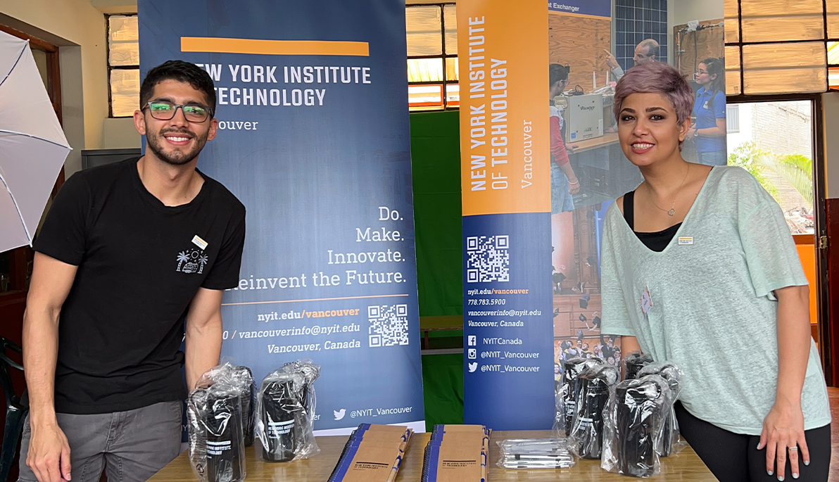 New York Tech students Anthony Song Lara and Parisa Mohamadi in front of a table