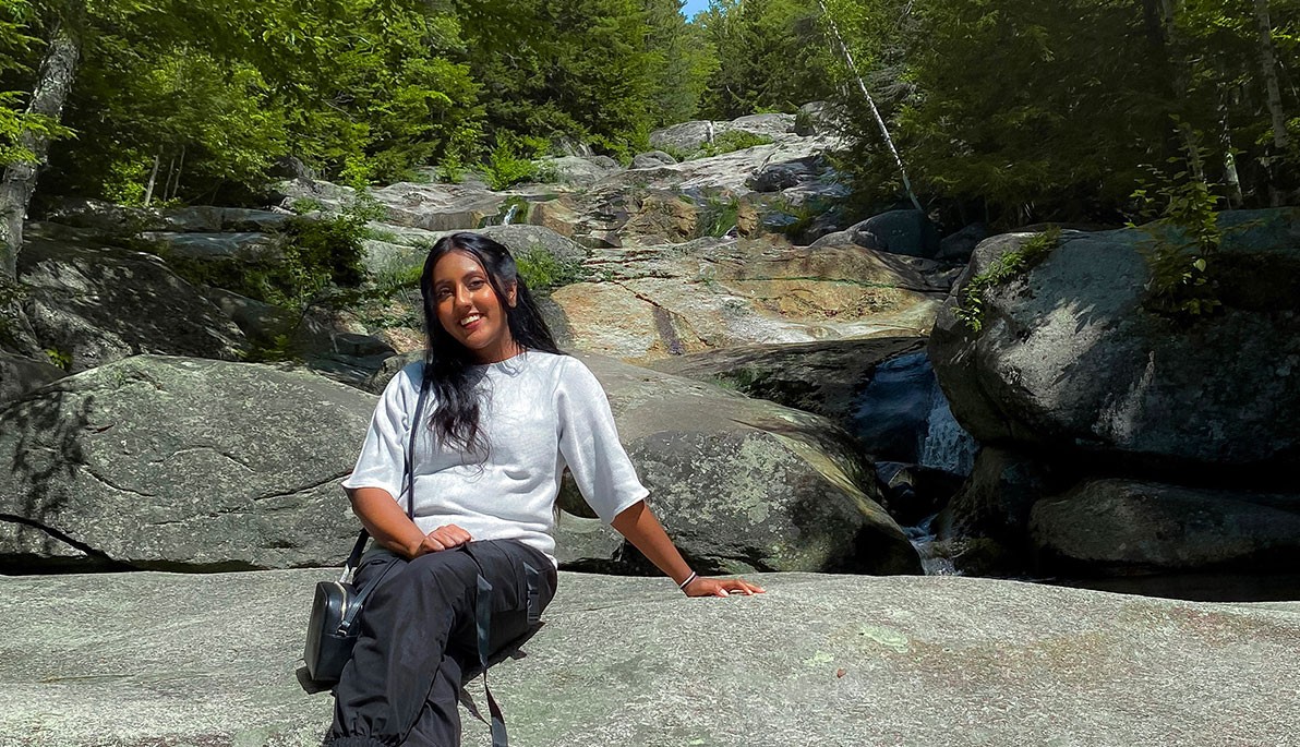 Nazia Rahman sitting on a rock