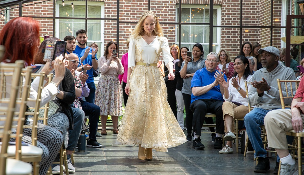  A model walks the runway in an adaptive wedding dress.