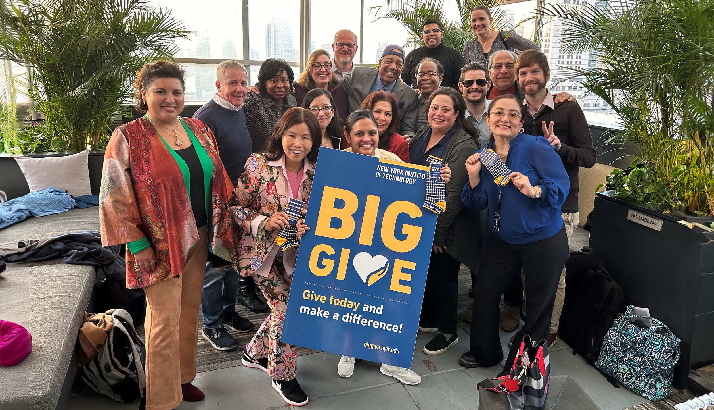 New York Tech faculty and staff holding a sign that says Big Give