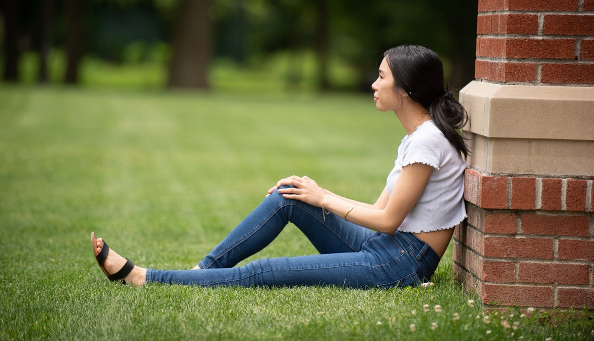Woman sitting on a lawn