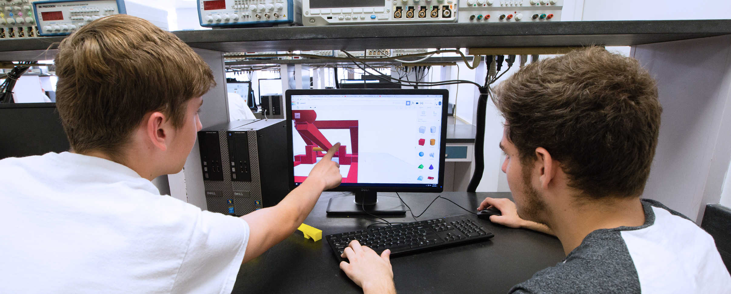 Two students looking at a graphics program