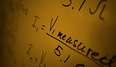 Equations on dry erase board