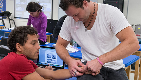 Student checking patient's vitals
