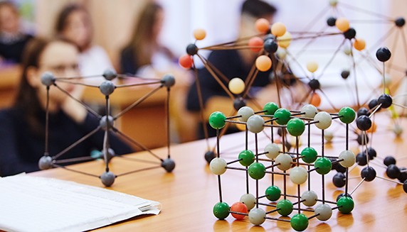 model atoms on lecture desk