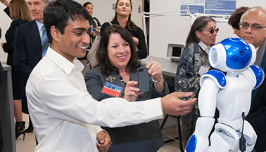 Group at presentation with robot