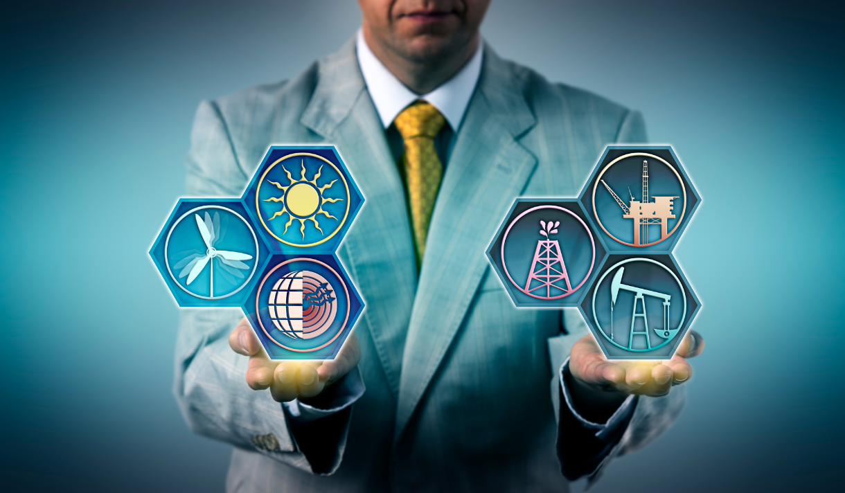 Man holding images of a sun, wind turbine, and other energy icons