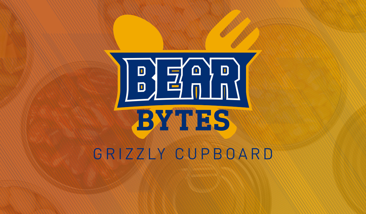 Spoon and fork on a brown background with the Bear Bytes Grizzly Cupboard logo