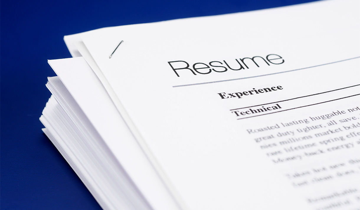 A stack of printed resumes 