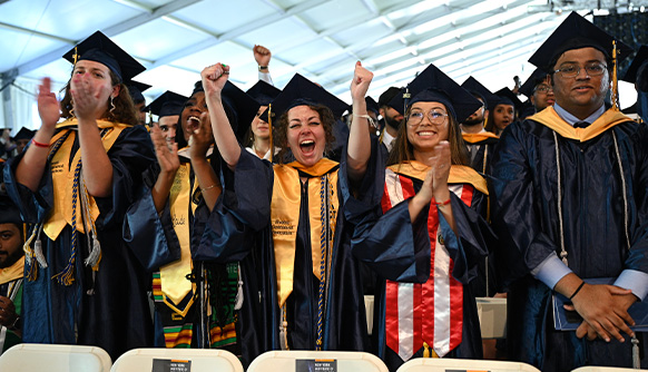 Students celebrating at New York Tech's commencement ceremony