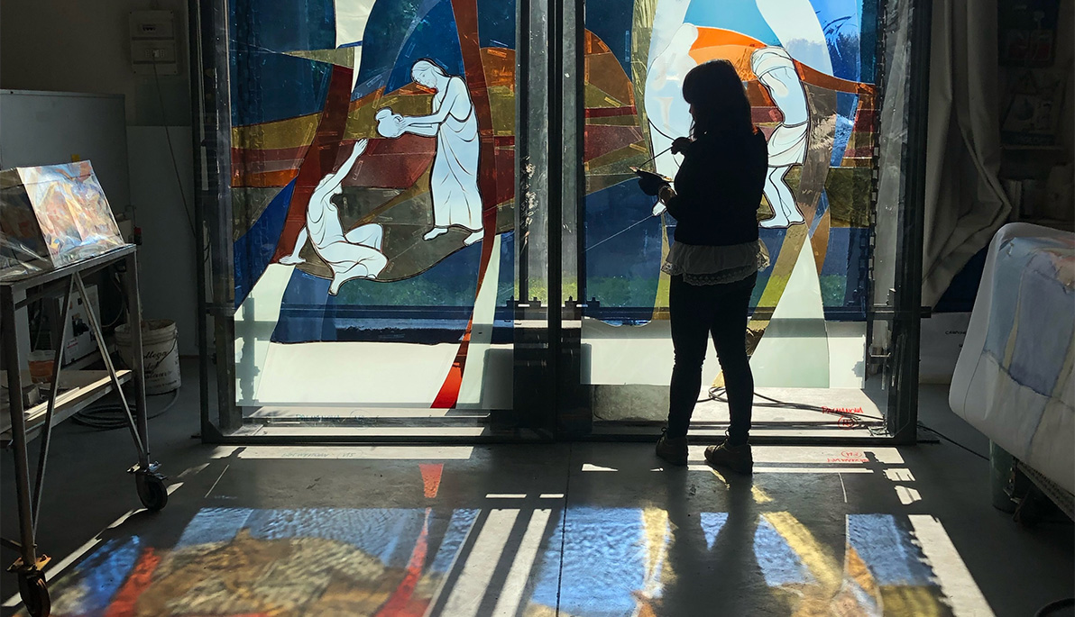 Artist working on a glass mosaic