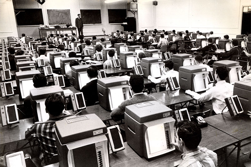 <strong>NYIT Introduced Teaching Machines on Campus in the 1950s</strong> Long before personal computers were ubiquitous, NYIT used computer technologies in the classroom. In the 1950s, the university introduced "teaching machines" in its labs, the forerunners to modern-day desktop computers. Pictured is an archival photo of NYIT students using teaching machines in an automated teaching lab.