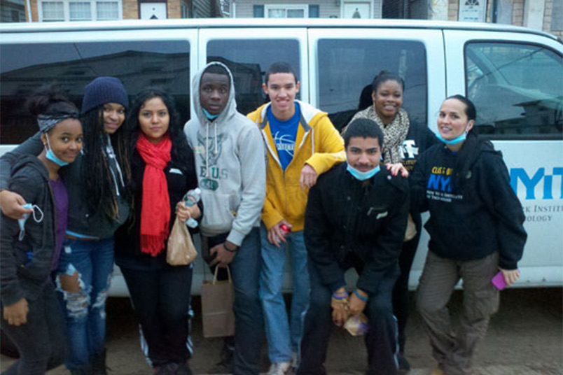 <strong>NYIT Staff Member Recalls Two Storms, Many Kindnesses</strong> Patricia Duran, director of student accounts, described how the NYIT community mobilized for Hurricane Sandy relief efforts in November 2012. Pictured are students and staff members who volunteered their time to help those in need.