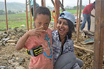 NYIT student Hinali Shah with one of the local children.