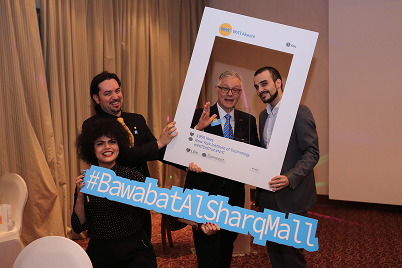 Sarah El Gohary, director, marketing and recruitment at NYIT-Abu Dhabi, and John Hyde, executive director of Career Services and Student Affairs, pose for pictures with an alumni (second from left) and the marketing manager of Bawabat Al Sharq Mall, the sponsor of the event.