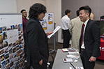 Edgar Arevalo (B.S. ’10, M.S. ’14) (left) interviews a potential candidate.