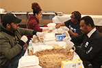 Volunteers prep meals and distribute care packages to the homeless at Saint Paul the Apostle Church in Manhattan.